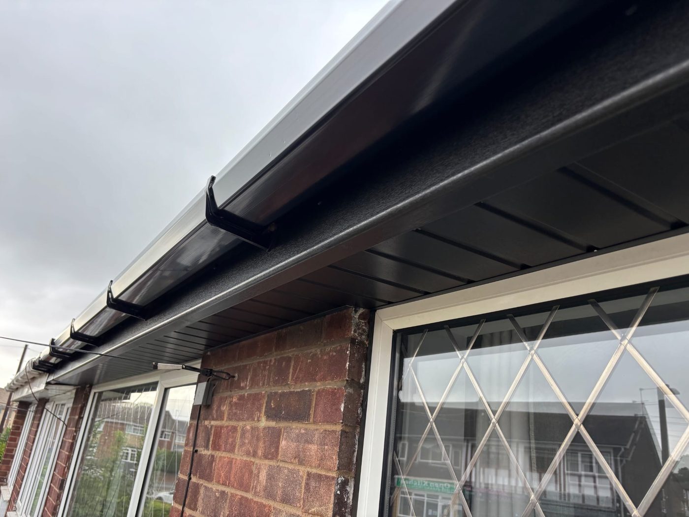 Black fascia and soffit replacement on a bungalow